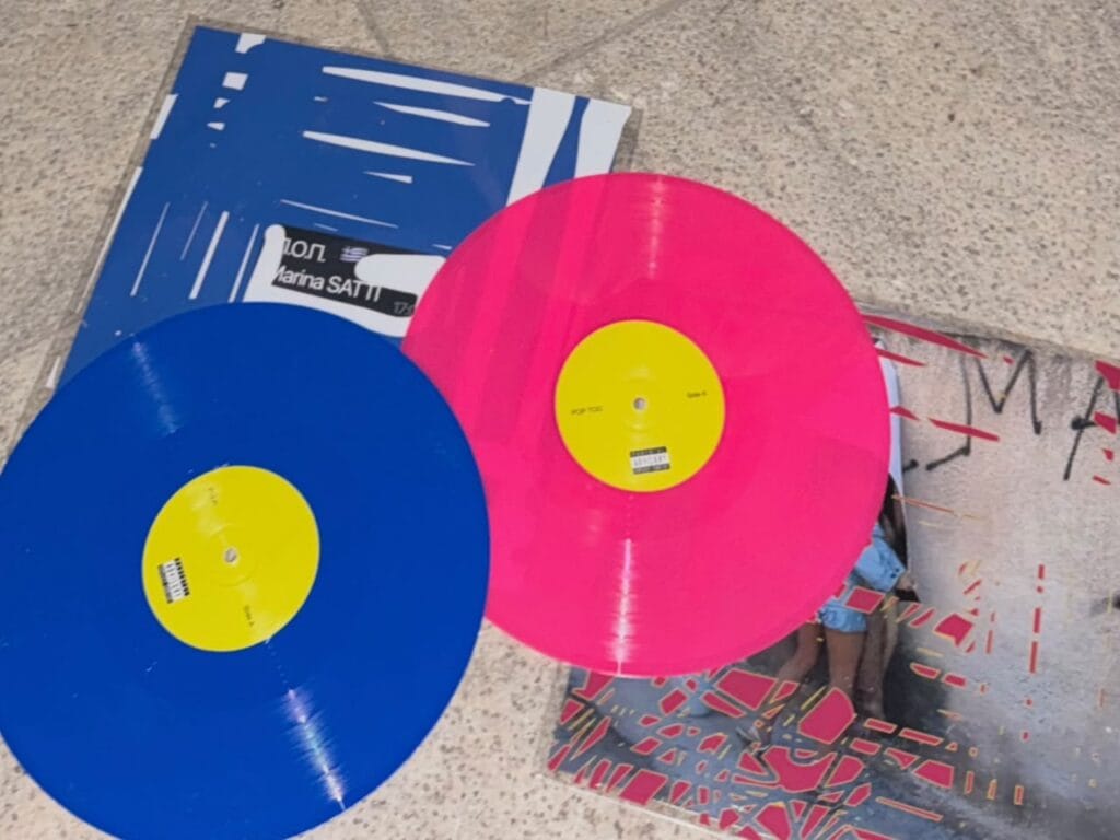 The P.O.P. and POP TOO vinyl records with their sleeves